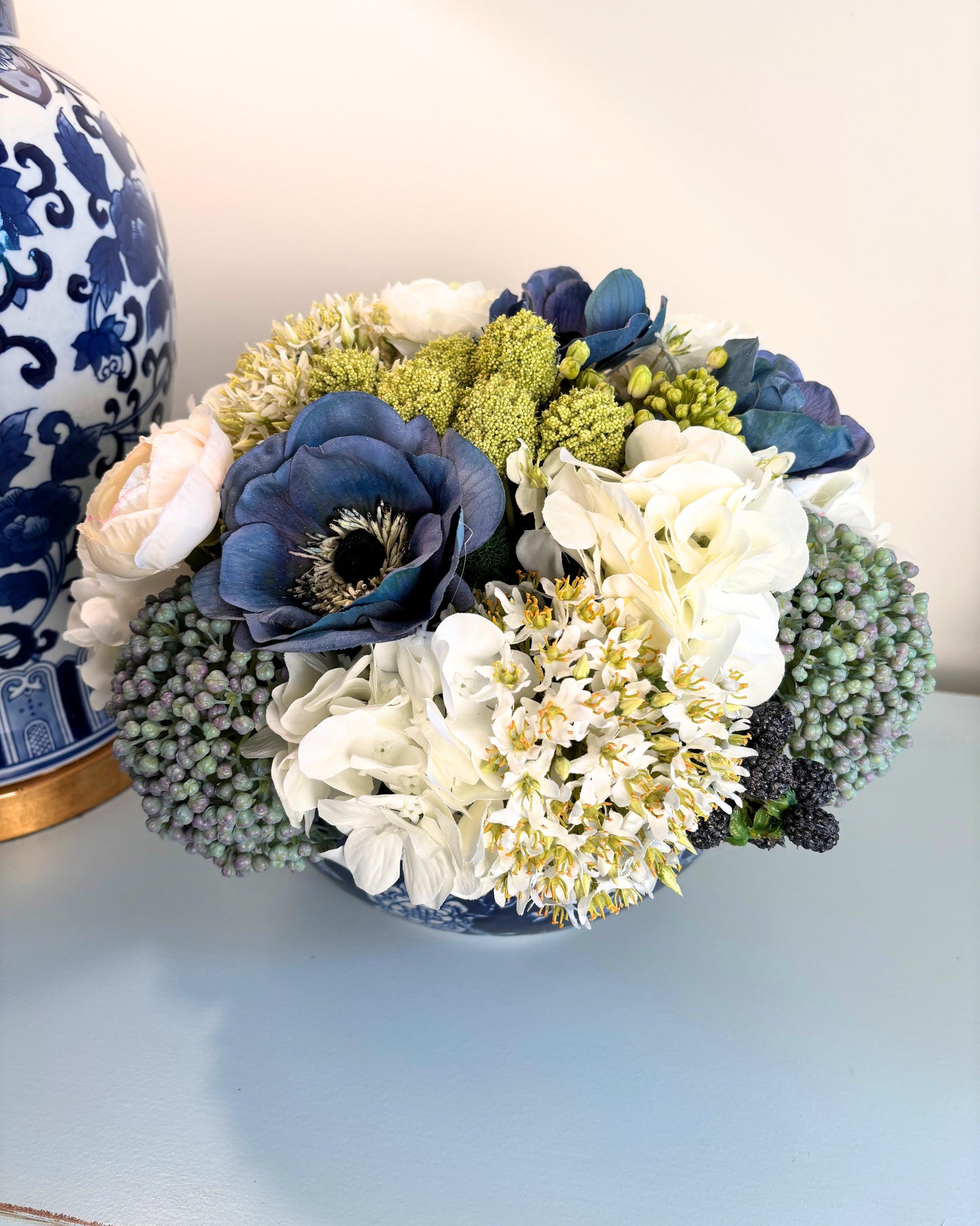Sedum, Hydrangea, Ranunculus, and Blackberry in Blue/White Bowl