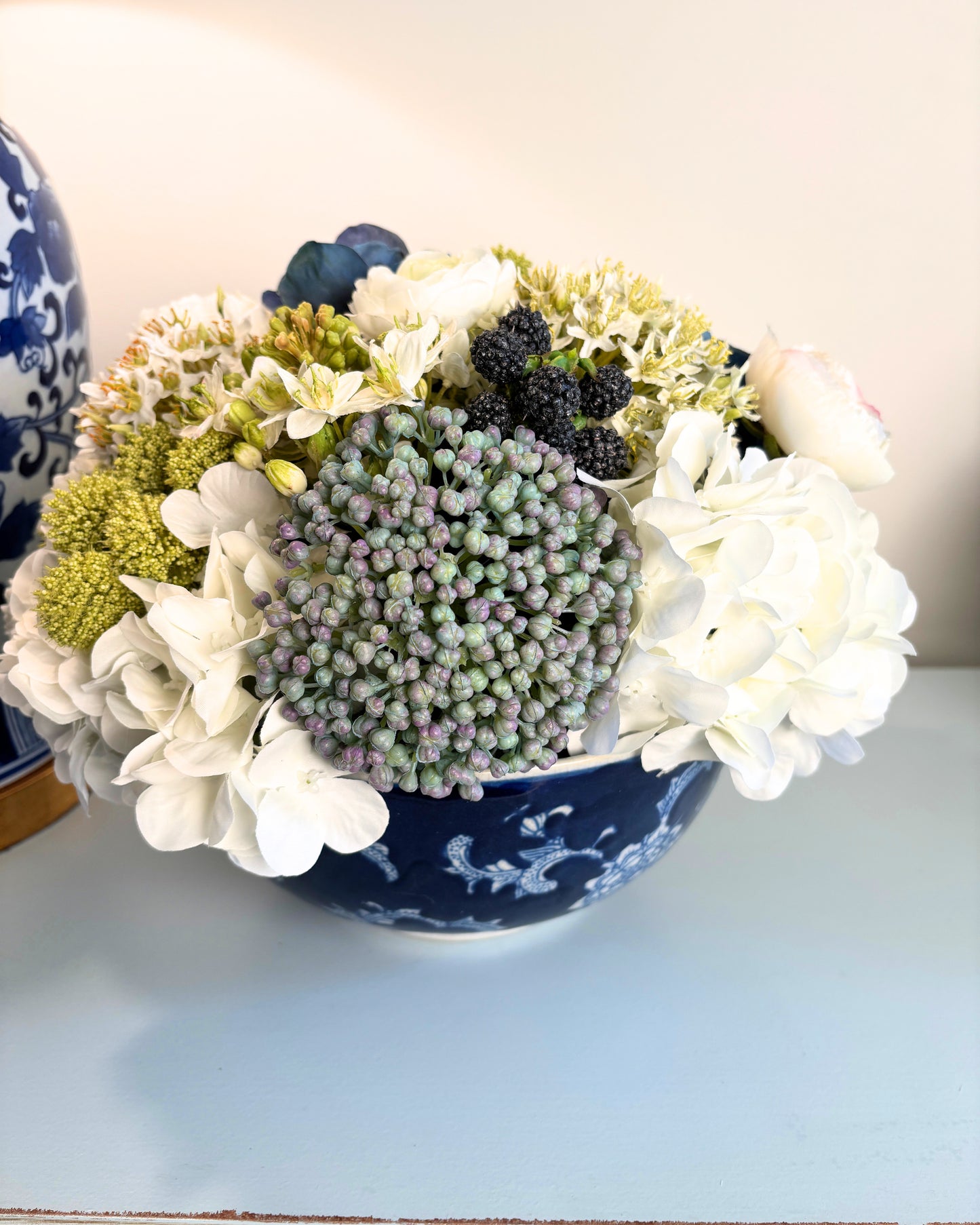 Sedum, Hydrangea, Ranunculus, and Blackberry in Blue/White Bowl