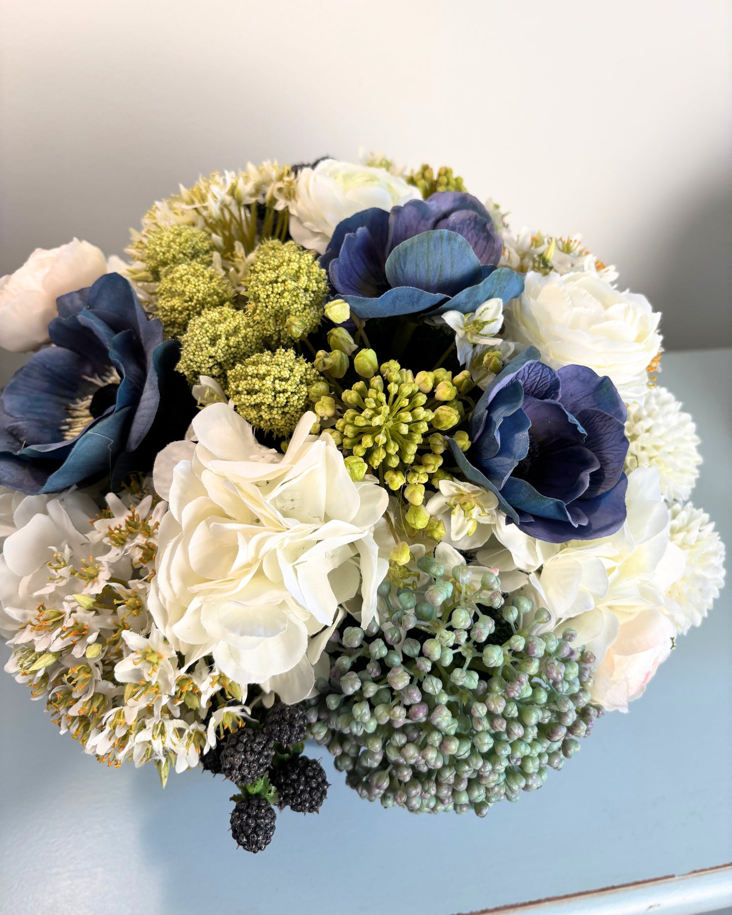 Sedum, Hydrangea, Ranunculus, and Blackberry in Blue/White Bowl