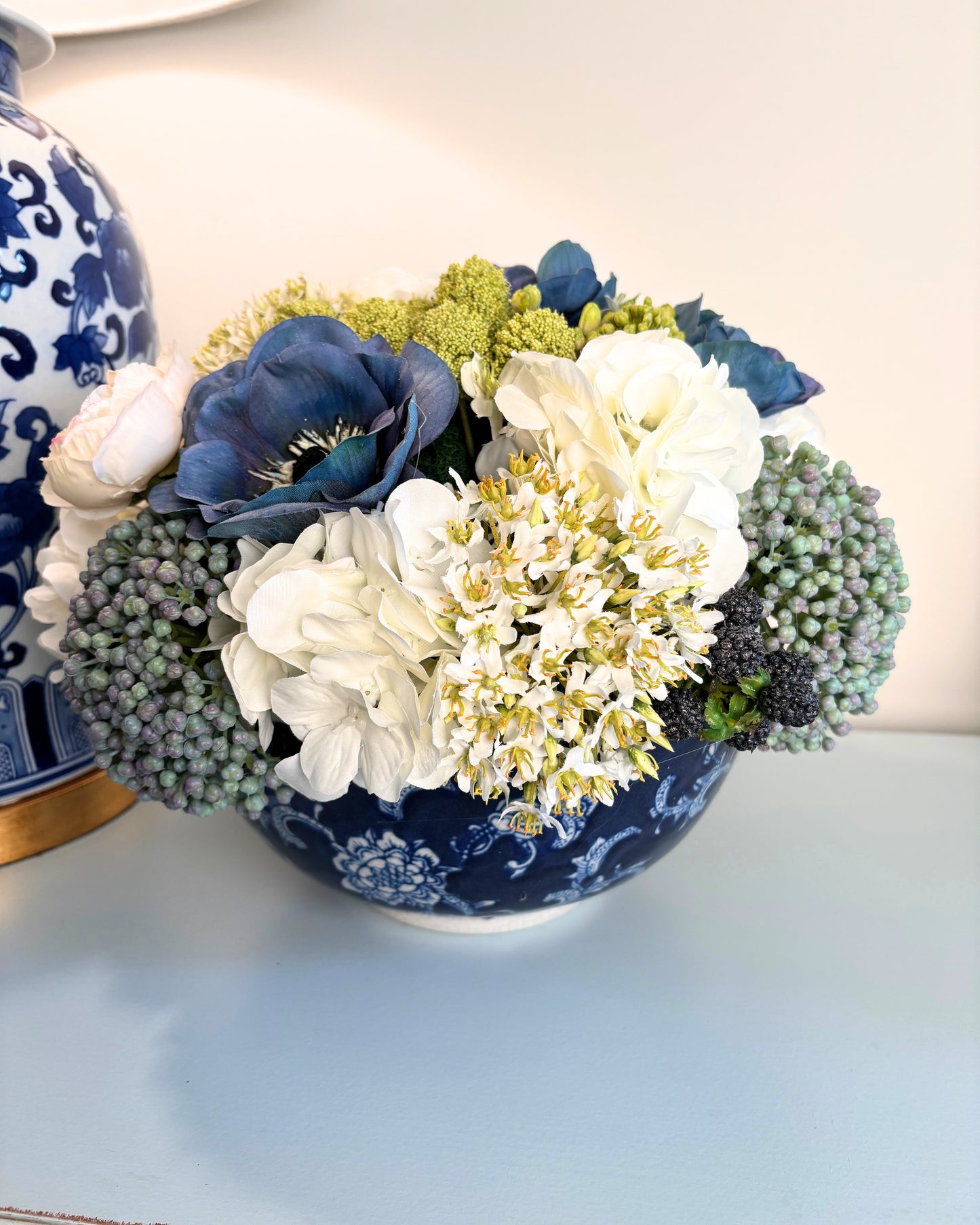 Sedum, Hydrangea, Ranunculus, and Blackberry in Blue/White Bowl