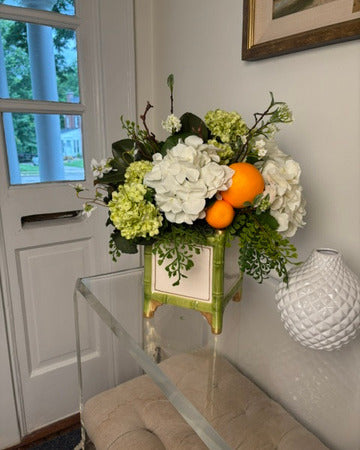 Amaryllis, Hydrangea, and Oranges in Bamboo Cache Pot